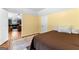 Bedroom showcasing laminate wood floors, closet doors, and access to the basement rec room at 135 Birdsong Ln, Fayetteville, GA 30215