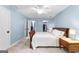 Spacious bedroom with large closets, ceiling fan, and neutral carpet at 135 Birdsong Ln, Fayetteville, GA 30215