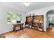 Inviting dining room with natural light from a large window, hardwood floors, and ample storage at 135 Birdsong Ln, Fayetteville, GA 30215