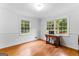 Bright dining room with natural light, hardwood floors, and modern fixtures for gatherings at 135 Birdsong Ln, Fayetteville, GA 30215