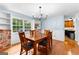 Dining room has hardwood floors, a decorative chandelier, and large windows that provide natural light at 135 Birdsong Ln, Fayetteville, GA 30215