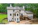Two-story home with an expansive back deck, solar panels, and wooded views at 135 Birdsong Ln, Fayetteville, GA 30215