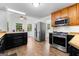 Stylish kitchen with stainless steel appliances, ample counter space, and modern cabinetry at 135 Birdsong Ln, Fayetteville, GA 30215