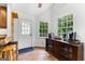 Eat-in kitchen features a breakfast nook with barstool seating and ample natural light at 135 Birdsong Ln, Fayetteville, GA 30215