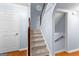 Staircase with a decorative railing leads to the upper level of the home at 135 Birdsong Ln, Fayetteville, GA 30215