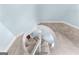 Unique top-down view of a spiral staircase with neutral carpet at 135 Birdsong Ln, Fayetteville, GA 30215