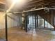 Unfinished basement with exposed utilities and concrete floor at 2820 Lloyd Rd, Decatur, GA 30034