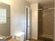 Bathroom featuring a tiled shower, granite countertops, and a window at 2820 Lloyd Rd, Decatur, GA 30034