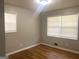 Cozy bedroom with hardwood floors and plenty of natural light from two windows at 2820 Lloyd Rd, Decatur, GA 30034