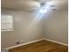 Comfortable bedroom featuring a ceiling fan, hardwood floors, and a bright window at 2820 Lloyd Rd, Decatur, GA 30034