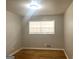 This bedroom is filled with natural light from its large window and features hardwood floors at 2820 Lloyd Rd, Decatur, GA 30034