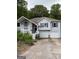 Charming two-story home with a two car garage and a welcoming front porch at 227 Cedars Glen Cir, Villa Rica, GA 30180