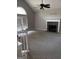 Bright living room with a vaulted ceiling, fireplace and french doors to the outside at 227 Cedars Glen Cir, Villa Rica, GA 30180