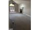 Bright living room with a vaulted ceiling, fireplace and french doors to the outside at 227 Cedars Glen Cir, Villa Rica, GA 30180