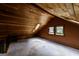 Attic area with wood ceiling and carpet floors, ideal for storage and additional space at 5780 Pumkintown Rd, Douglasville, GA 30135