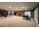 Expansive basement with fireplace, carpeted floor, and stone stairs, ideal for entertainment at 5780 Pumkintown Rd, Douglasville, GA 30135