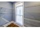 Organized walk-in closet with ample shelving for storage solutions with natural light at 5780 Pumkintown Rd, Douglasville, GA 30135