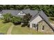 Charming exterior elevation with stone accents and well-maintained landscaping at 5780 Pumkintown Rd, Douglasville, GA 30135