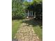 Inviting front yard with stone pathway leading to the home's entrance at 5780 Pumkintown Rd, Douglasville, GA 30135
