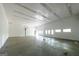 Spacious garage with high ceilings and ample room for storage and activities at 5780 Pumkintown Rd, Douglasville, GA 30135