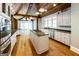 Bright kitchen featuring stainless appliances, granite countertops, custom cabinets and kitchen island at 5780 Pumkintown Rd, Douglasville, GA 30135