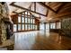 Expansive living room featuring hardwood floors, a stone fireplace, and plenty of natural light at 5780 Pumkintown Rd, Douglasville, GA 30135