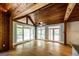 Bright living room featuring wood ceiling, hardwood floors and large windows for lots of natural light at 5780 Pumkintown Rd, Douglasville, GA 30135