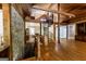Unique living space featuring a stone accent wall, spiral staircase, and wooden beam accents at 5780 Pumkintown Rd, Douglasville, GA 30135
