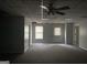 Finished basement featuring drop ceiling, fan and multiple doors at 9160 Woodhaven Way, Mcdonough, GA 30253