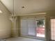 Bright dining room with chandelier, sliding glass doors leading to deck at 9160 Woodhaven Way, Mcdonough, GA 30253