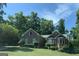 Charming brick home with mature trees, well-maintained lawn, and inviting curb appeal at 9160 Woodhaven Way, Mcdonough, GA 30253