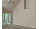 Living room area with high ceilings, double doors leading to additional space at 9160 Woodhaven Way, Mcdonough, GA 30253