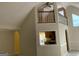 Open-concept living room with vaulted ceilings, staircase and views into the kitchen at 9160 Woodhaven Way, Mcdonough, GA 30253