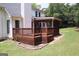 The backyard has a wooden deck and is surrounded by greenery, creating a tranquil outdoor space at 74 Flanders Ct, Douglasville, GA 30134