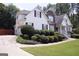 Charming two-story home with beautiful landscaping, a stone facade, and a well-manicured lawn at 74 Flanders Ct, Douglasville, GA 30134