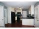 Well-equipped kitchen featuring granite countertops, modern appliances, and ample cabinet space at 74 Flanders Ct, Douglasville, GA 30134