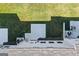 Birds-eye view of a well-maintained backyard with a lush green lawn and a concrete patio at 8747 Lakeview Commons # 1, Jonesboro, GA 30238