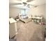 Carpeted bedroom with neutral paint and a full bedset has a window view and a ceiling fan at 7728 Fawn Cir, Covington, GA 30014