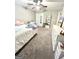 Cozy bedroom with ceiling fan, closet, and carpeted floor at 7728 Fawn Cir, Covington, GA 30014