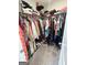 Spacious walk-in closet offering ample storage space for clothing at 7728 Fawn Cir, Covington, GA 30014
