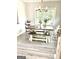 Bright dining area featuring a wooden table and ample natural light at 7728 Fawn Cir, Covington, GA 30014
