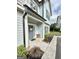 Inviting front porch with new home decorations and a gray door at 7728 Fawn Cir, Covington, GA 30014