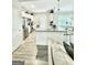 Open kitchen with stainless steel appliances and a granite countertop at 7728 Fawn Cir, Covington, GA 30014