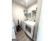 Efficient laundry area with modern washer and dryer units at 7728 Fawn Cir, Covington, GA 30014