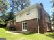 Exterior view of the back of the house, highlighting the brick and siding at 443 S Rays Rd, Stone Mountain, GA 30083