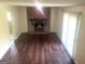 Spacious living room showcasing a cozy fireplace and large sliding glass doors at 443 S Rays Rd, Stone Mountain, GA 30083