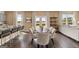 Inviting dining area with stylish seating, open to the kitchen and living room areas with backyard views at 608 Whitman Lane # 2028, Stockbridge, GA 30281