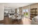 Open-concept dining area with modern light gray kitchen cabinets and a view of the outdoor space at 608 Whitman Lane # 2028, Stockbridge, GA 30281