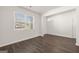 Living room features an open floor plan, hardwood floors and a window at 608 Whitman Lane # 2028, Stockbridge, GA 30281