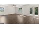 Living room features a ceiling fan and doors to the backyard at 608 Whitman Lane # 2028, Stockbridge, GA 30281
